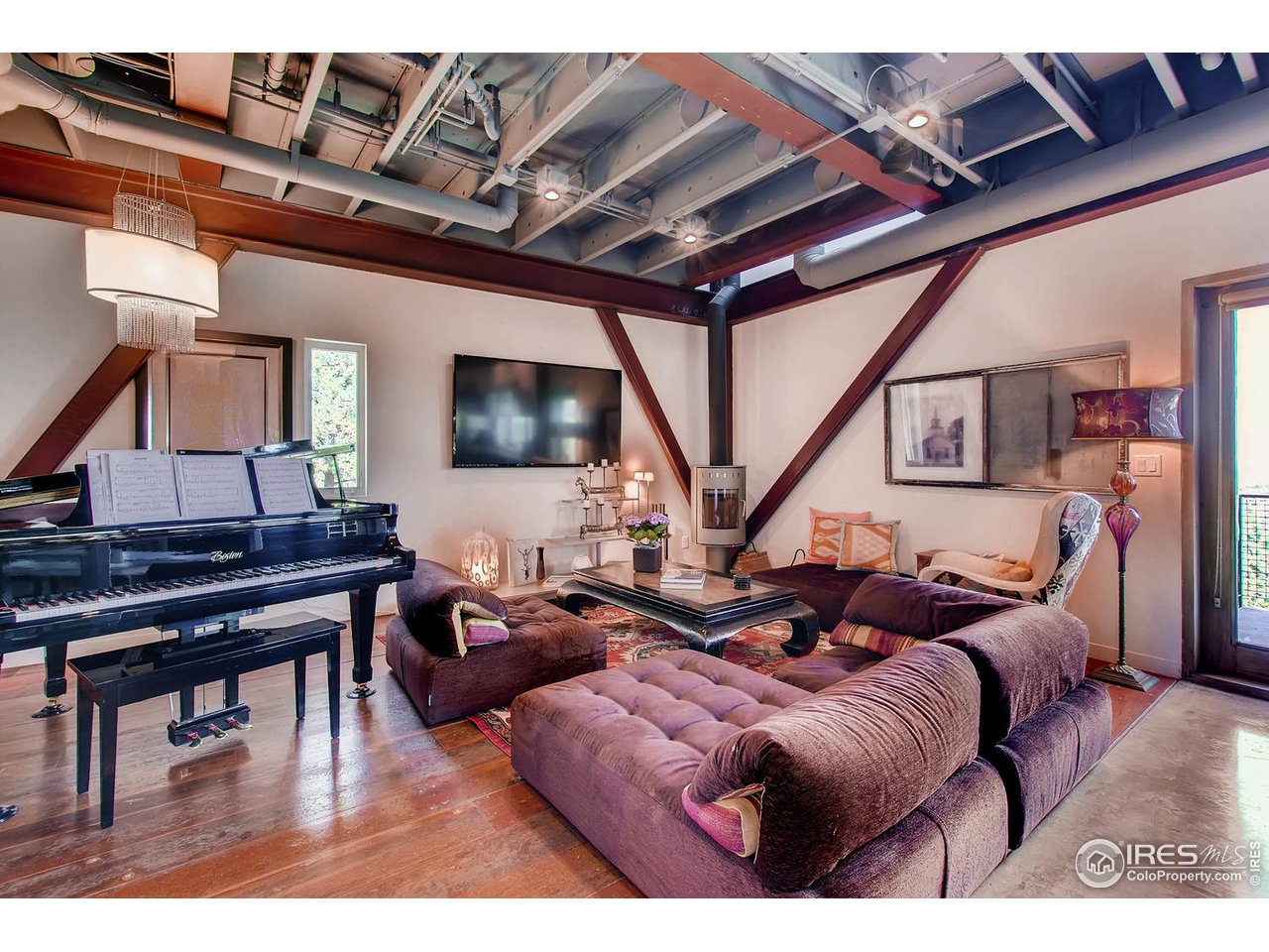 1440 Reed Ranch Road Boulder, CO 80302 - Photo 22 of 40 a living room with furniture and a flat screen tv
