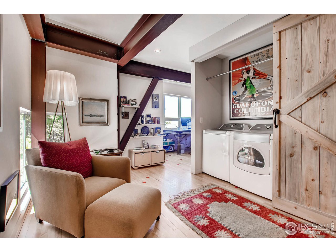 1440 Reed Ranch Road Boulder, CO 80302 - Photo 23 of 40 a living room with furniture a rug and white walls