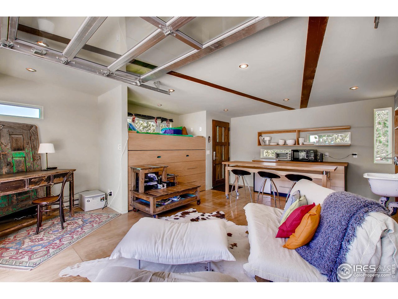1440 Reed Ranch Road Boulder, CO 80302 - Photo 24 of 40 a living room with furniture and a flat screen tv
