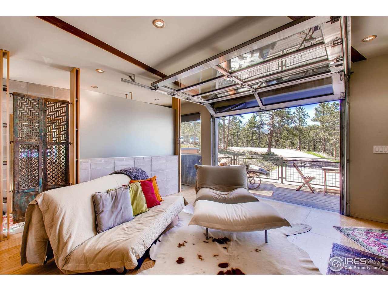 1440 Reed Ranch Road Boulder, CO 80302 - Photo 27 of 40 a living room with furniture and a floor to ceiling window