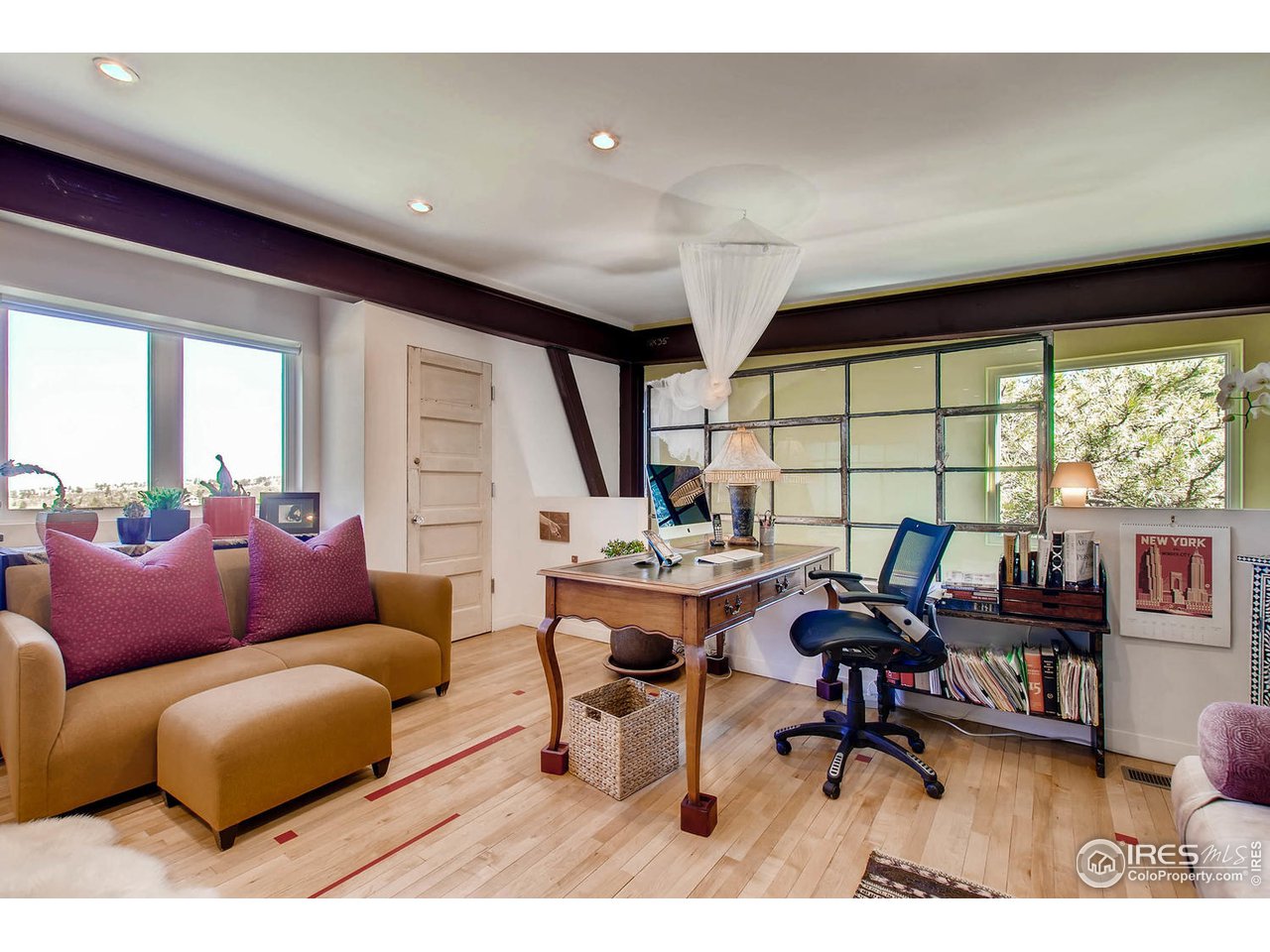 1440 Reed Ranch Road Boulder, CO 80302 - Photo 9 of 40 a living room with furniture a rug and a large window