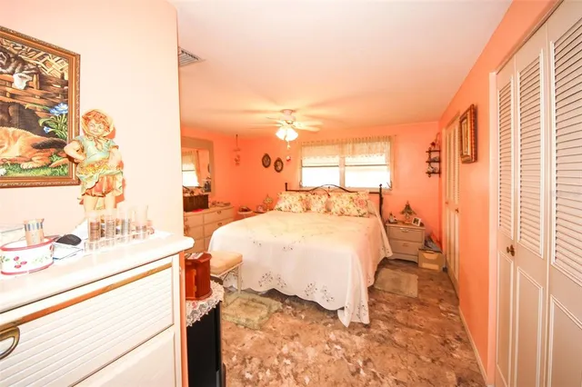 a bathroom with a granite countertop toilet a sink and a mirror