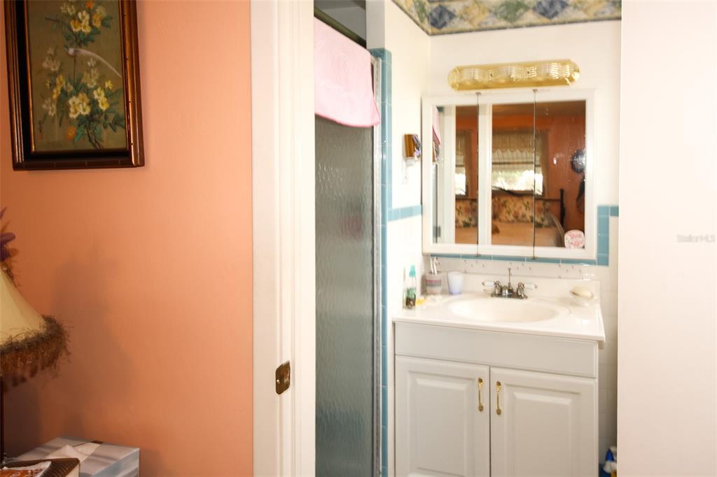 10638 Oak Hill Drive Port Richey, FL 34668 - Photo 13 of 29 a bathroom with a sink and a mirror