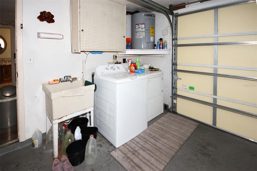 10638 Oak Hill Drive Port Richey, FL 34668 - Photo 24 of 29 a utility room with dryer and washer