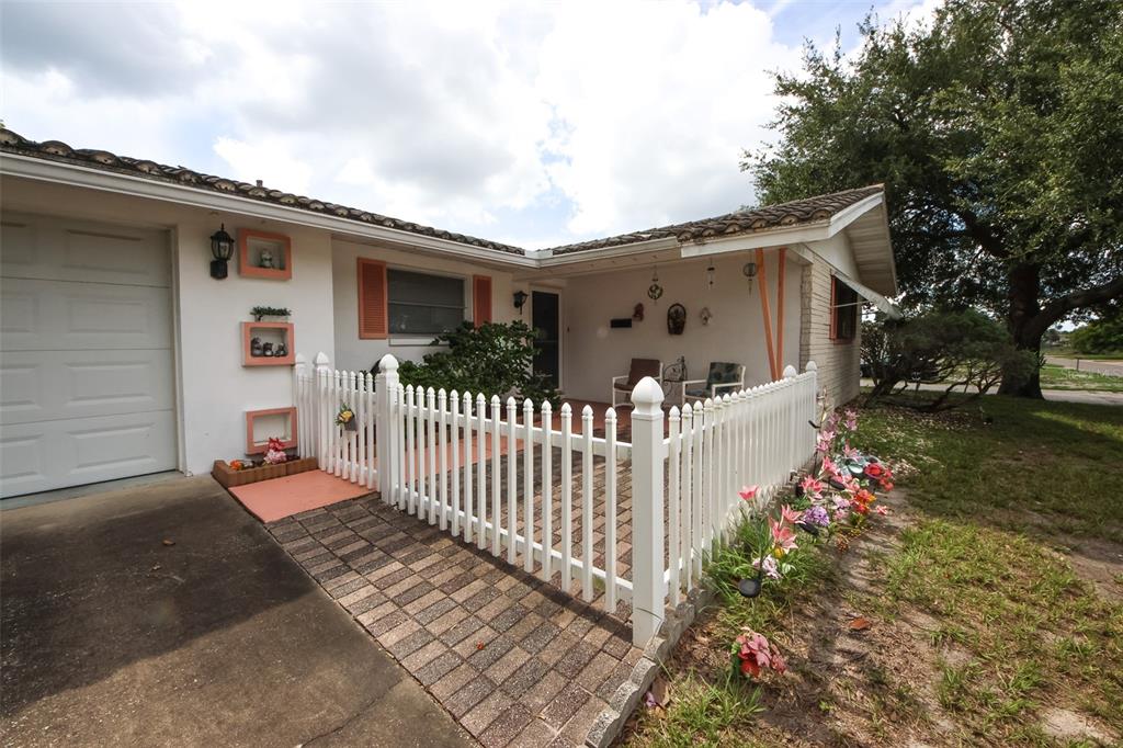 10638 Oak Hill Drive Port Richey, FL 34668 - Photo 3 of 29 a white house that has tree in front of it