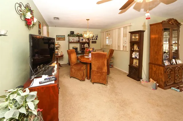 a living room with fireplace furniture and a flat screen tv