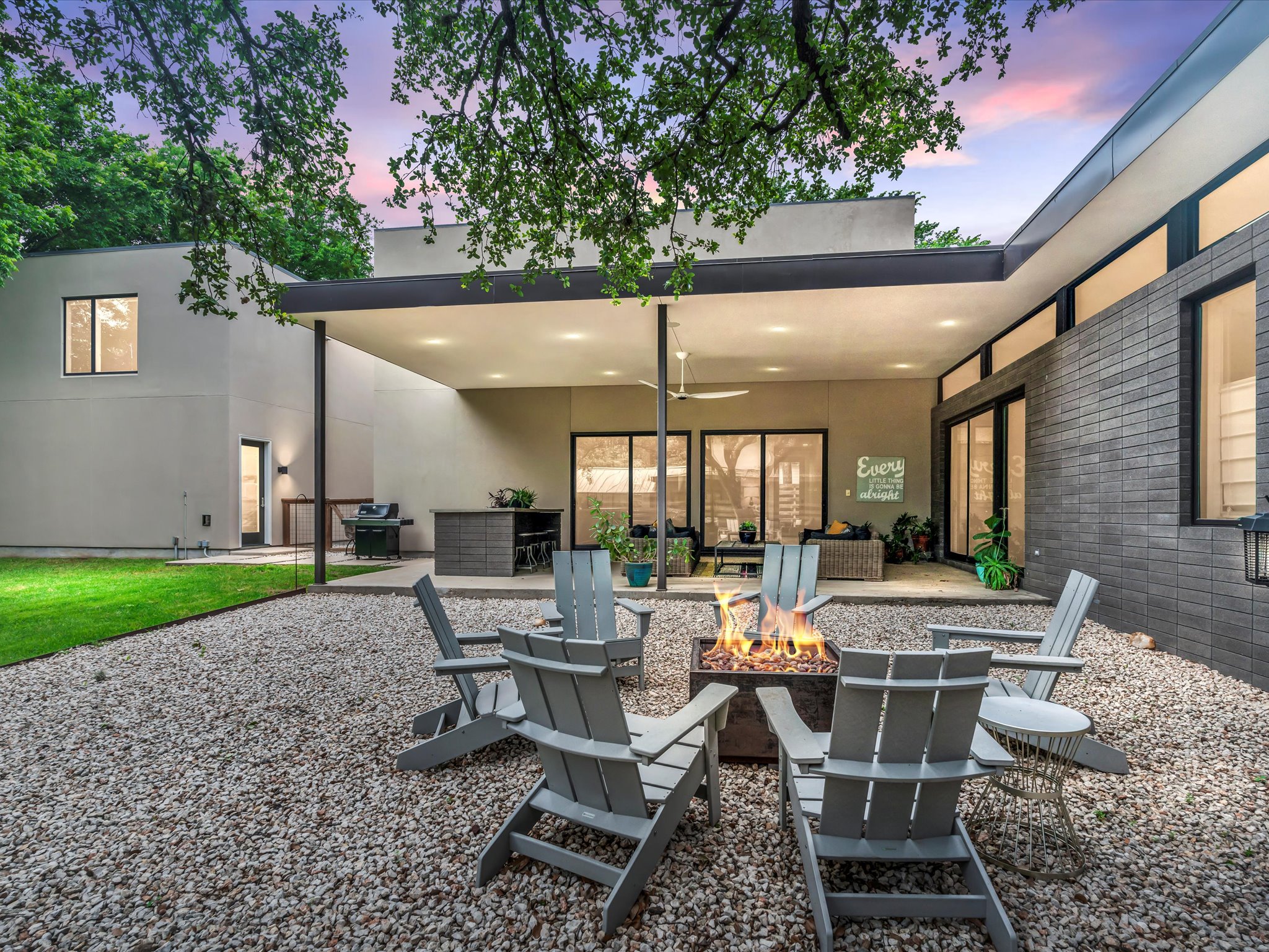 1703 Dexter Street Austin, TX 78704 - Photo 1 of 1 a view of a patio with table and chairs and potted plants