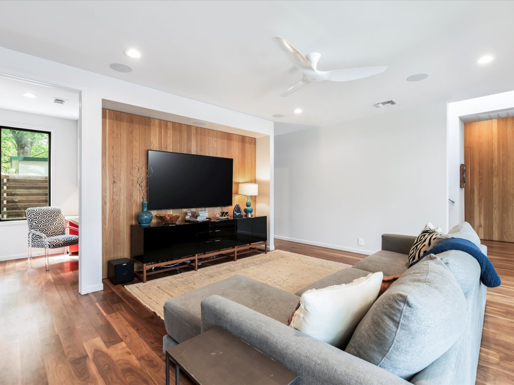 1703 Dexter Street Austin, TX 78704 - Photo 12 of 34 Living room featuring wood finished floors, ceiling fan, and recessed lighting