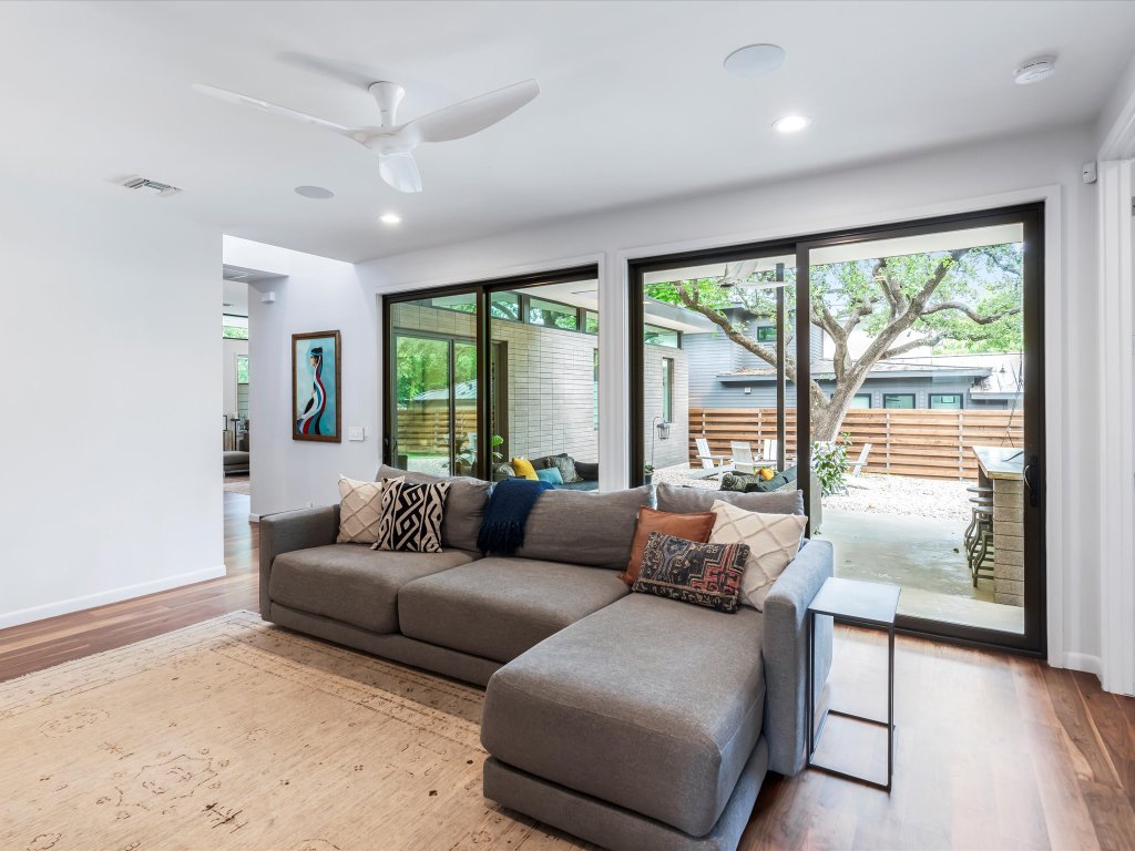 1703 Dexter Street Austin, TX 78704 - Photo 13 of 34 Living room featuring wood finished floors and a ceiling fan