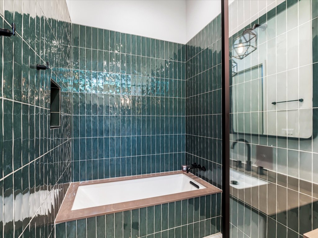 1703 Dexter Street Austin, TX 78704 - Photo 18 of 34 Full bath featuring tiled shower / bath