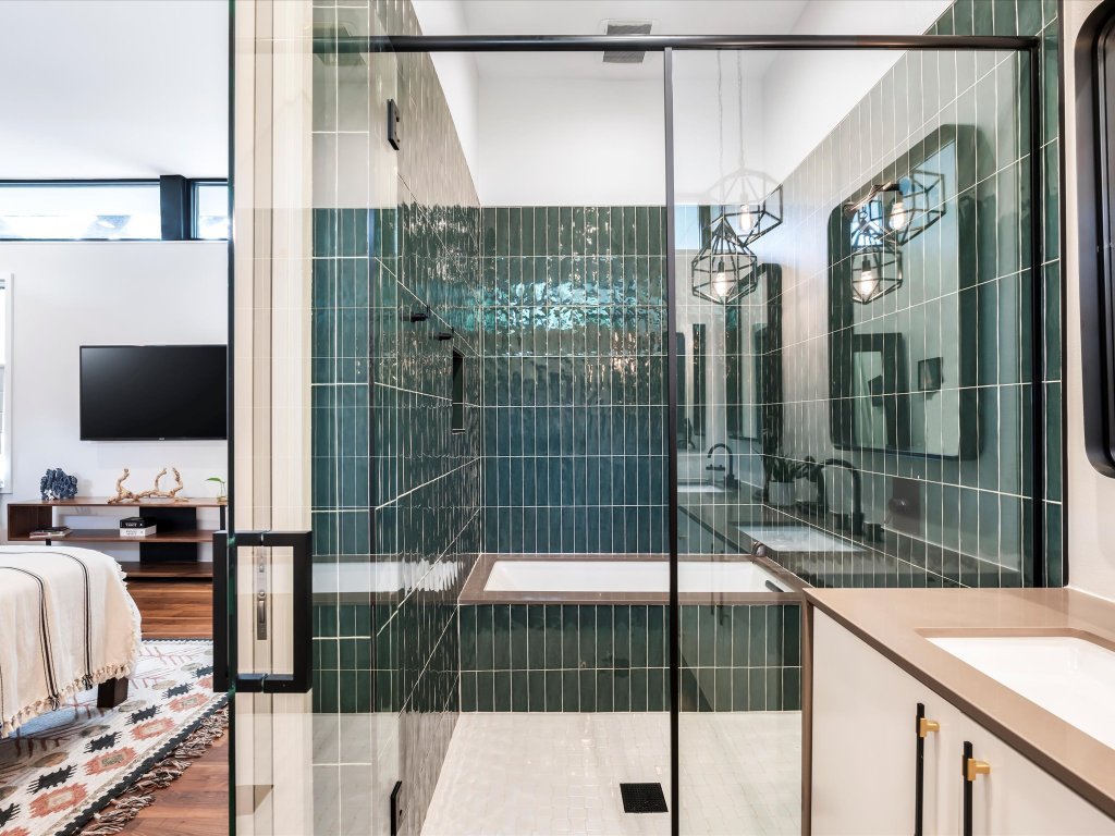 1703 Dexter Street Austin, TX 78704 - Photo 19 of 34 Full bath with a relaxing tiled tub, vanity, and tiled shower