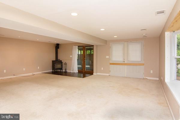2125 Folkstone Road Lutherville-Timonium, MD 21093 - Photo 23 of 30 Family Room with Wood Stove and 2 Outside Exits
