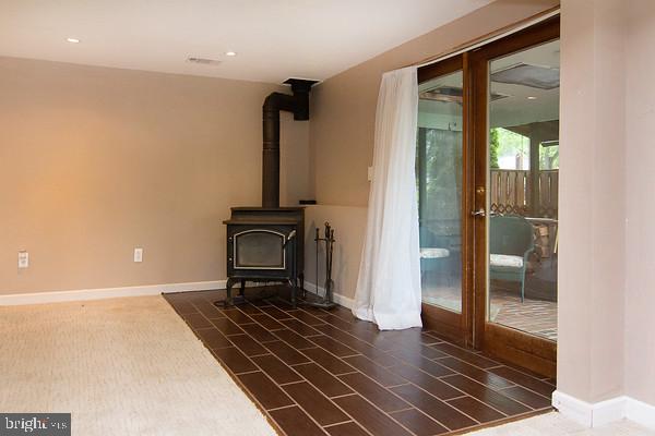 2125 Folkstone Road Lutherville-Timonium, MD 21093 - Photo 24 of 30 Wood Stove and Sliders to Covered Patio