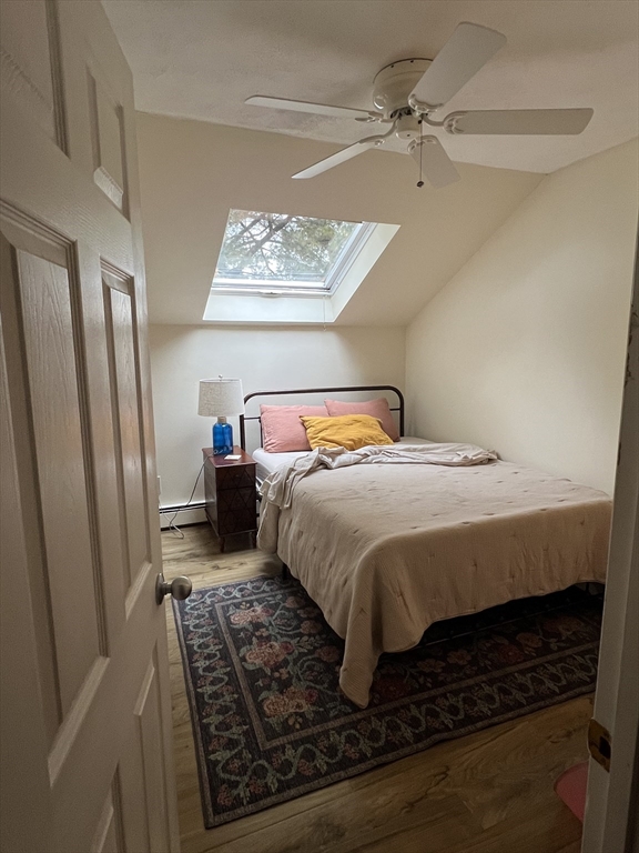 46 Auburndale Avenue, Unit 46 Newton, MA 02465 - Photo 13 of 17 a bedroom with a bed and wooden floor