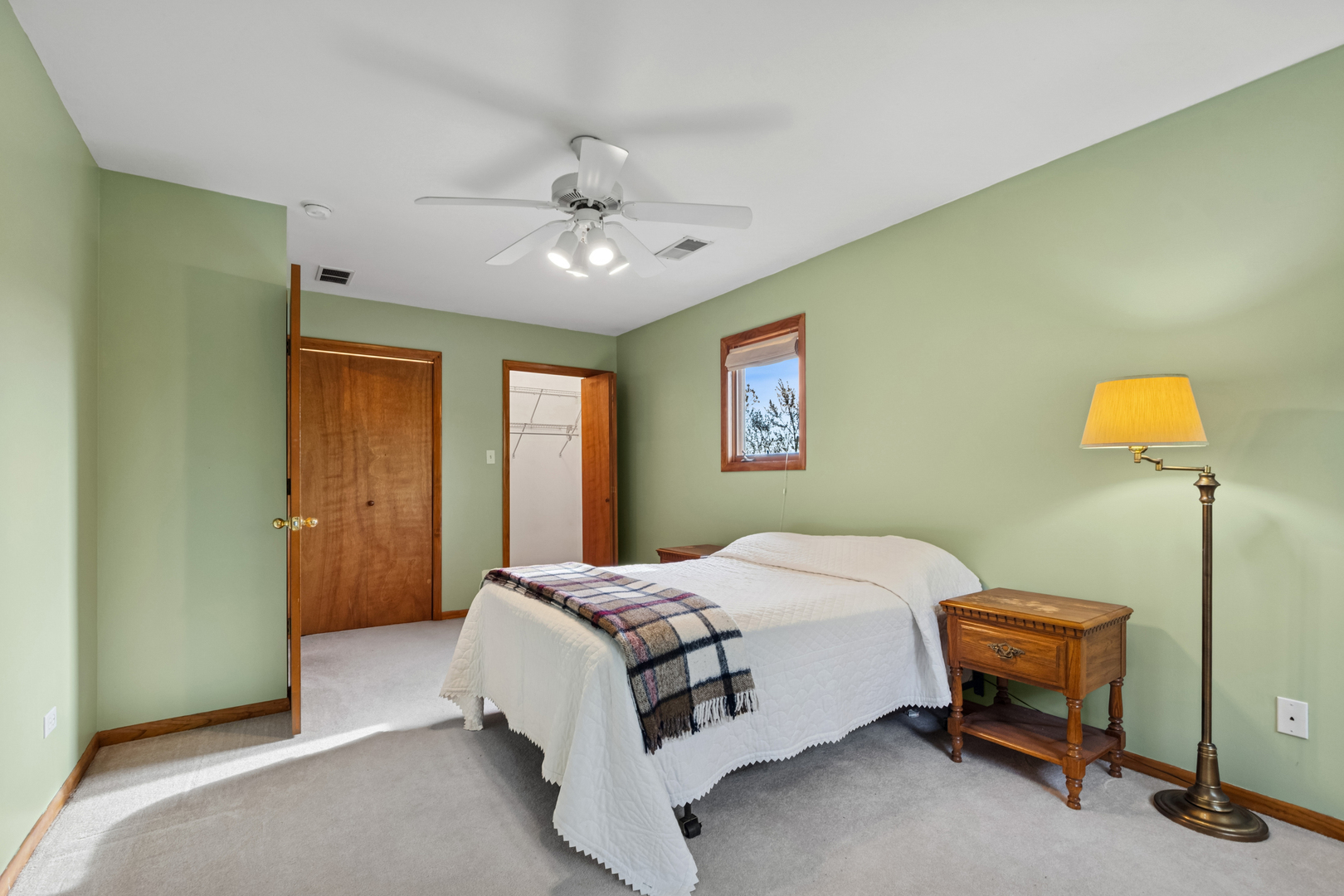 1253 Arthur Street Calumet City, IL 60409 - Photo 13 of 20 a bedroom with a bed and a chandelier