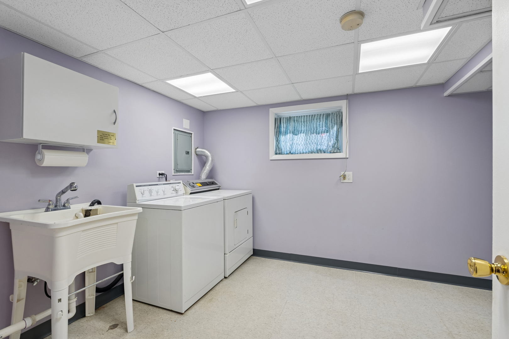 1253 Arthur Street Calumet City, IL 60409 - Photo 14 of 20 a room with a sink cabinets and a window