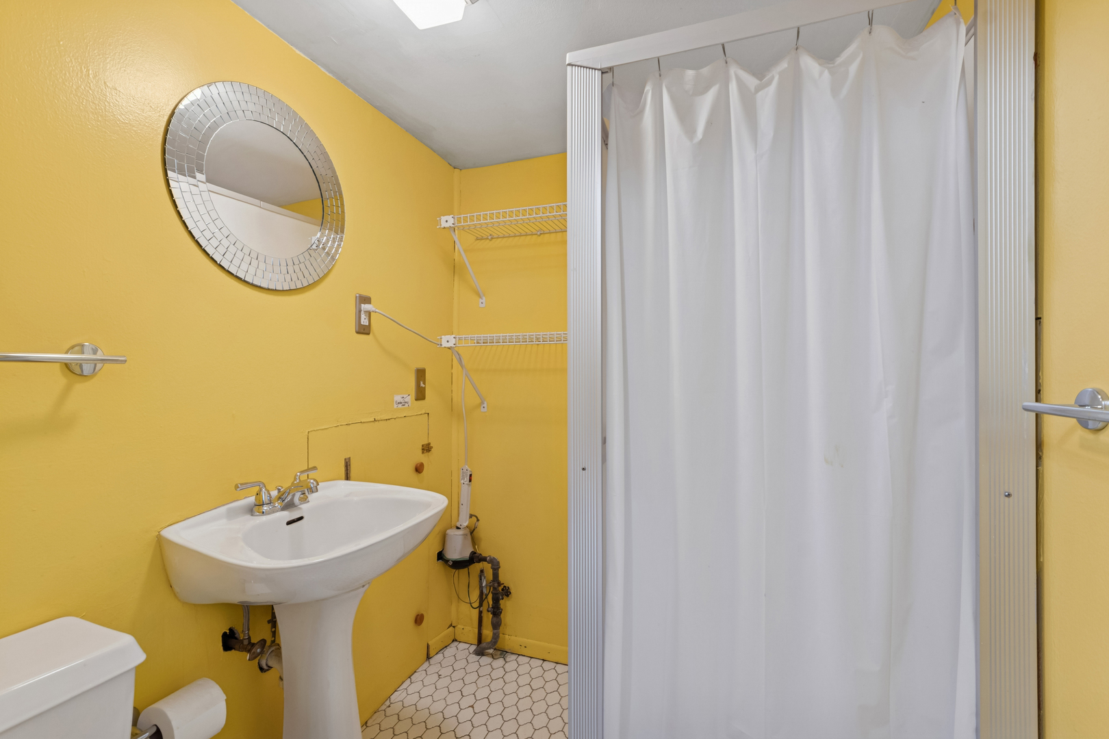 1253 Arthur Street Calumet City, IL 60409 - Photo 15 of 20 a bathroom with a sink and a mirror
