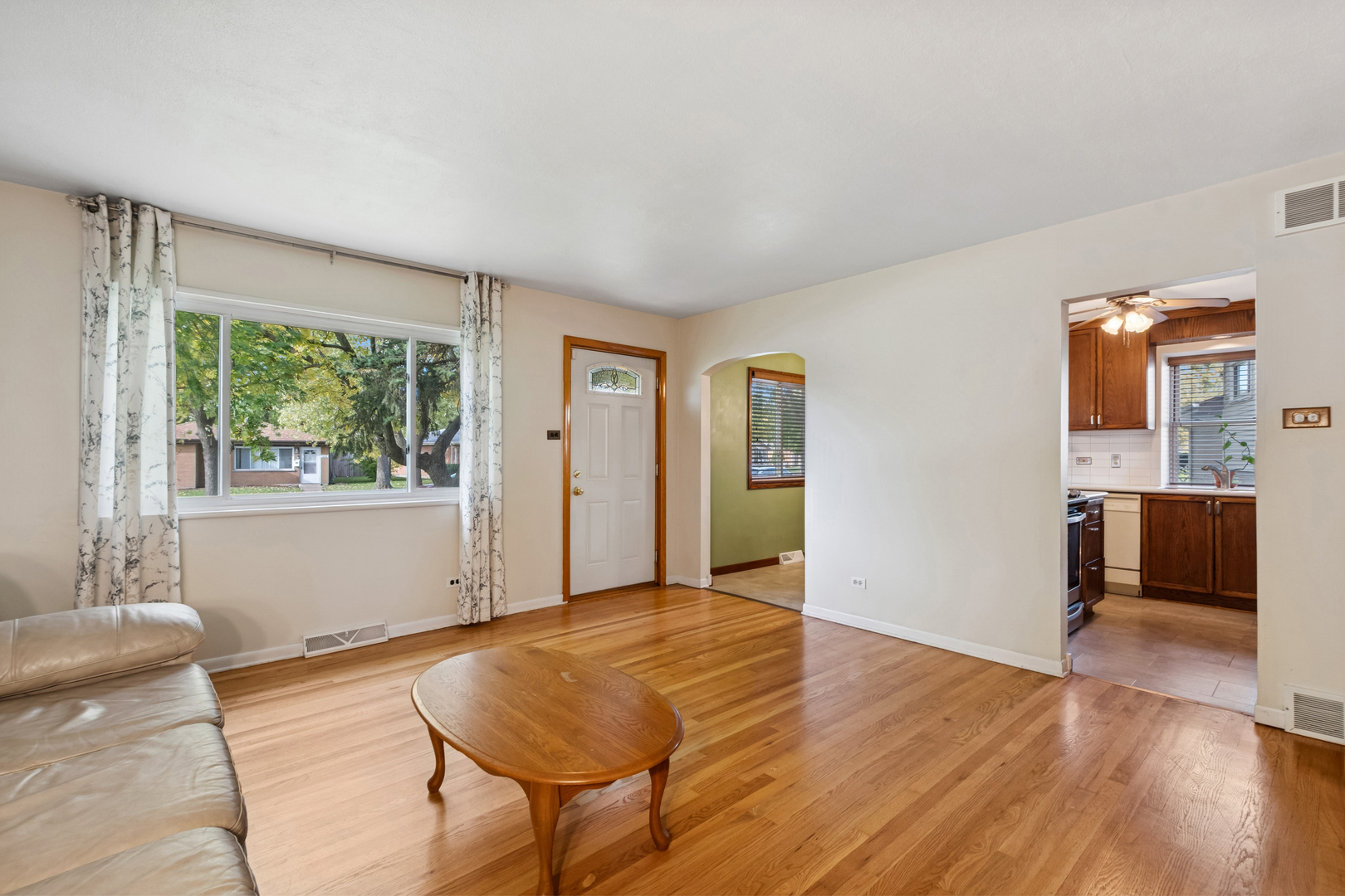 1253 Arthur Street Calumet City, IL 60409 - Photo 3 of 20 a spacious bedroom with a bed and a window