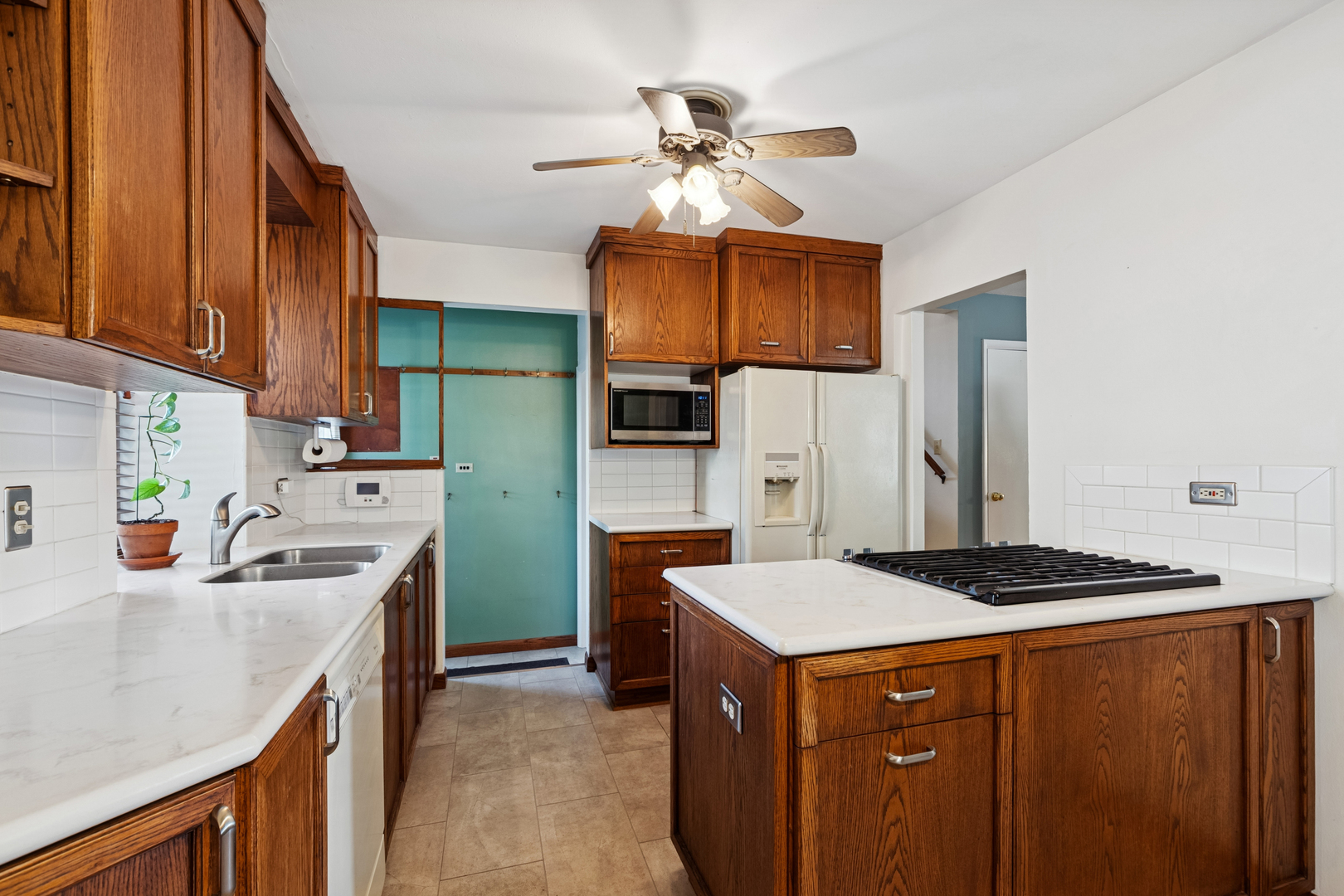 1253 Arthur Street Calumet City, IL 60409 - Photo 5 of 20 a kitchen that has a cabinets and a stove