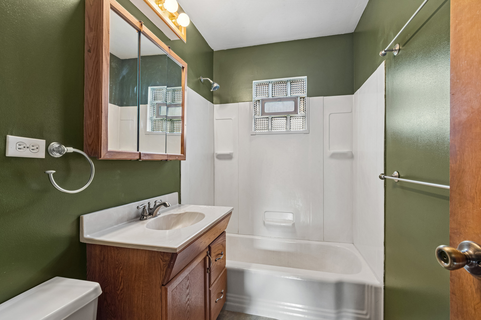 1253 Arthur Street Calumet City, IL 60409 - Photo 7 of 20 a bathroom with a sink a toilet and shower