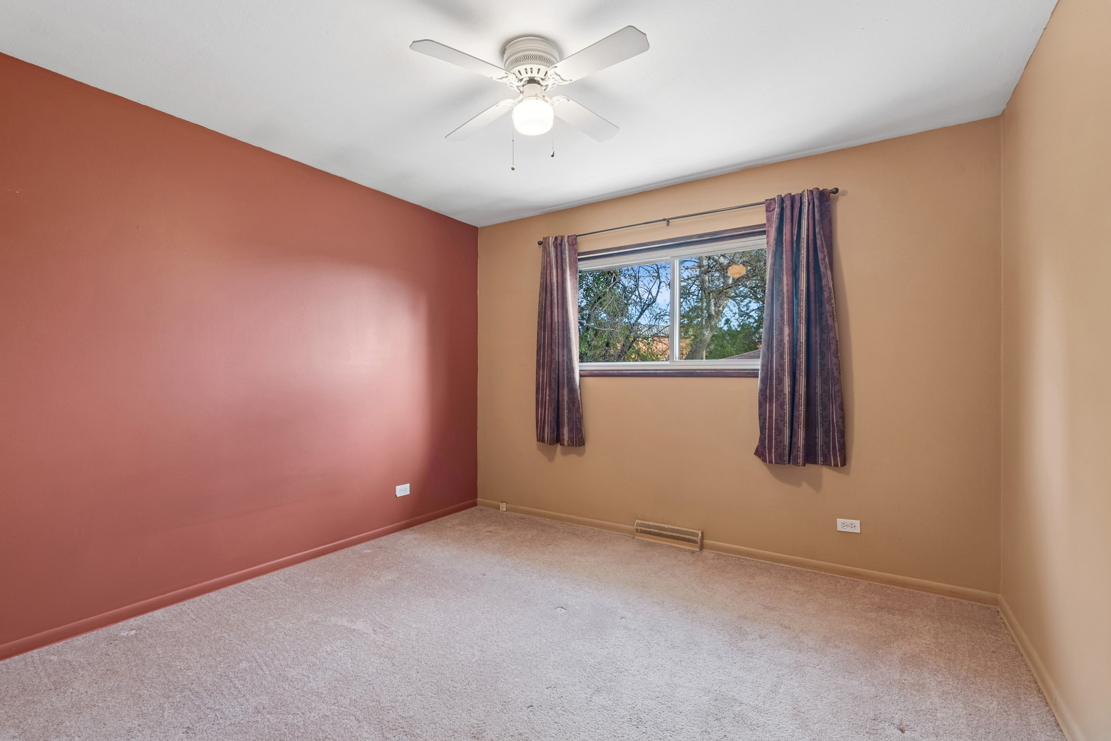 1253 Arthur Street Calumet City, IL 60409 - Photo 8 of 20 an empty room with windows and ceiling fan