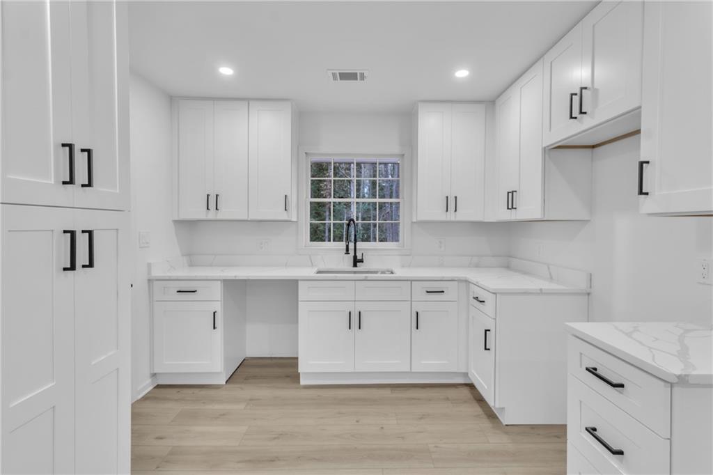 3296 Columbia Woods Drive Decatur, GA 30032 - Photo 11 of 47 a kitchen with a sink cabinets and window