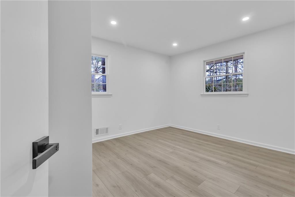 3296 Columbia Woods Drive Decatur, GA 30032 - Photo 17 of 47 an empty room with wooden floor