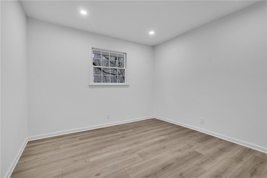 3296 Columbia Woods Drive Decatur, GA 30032 - Photo 19 of 47 a view of a room with wooden floor and window