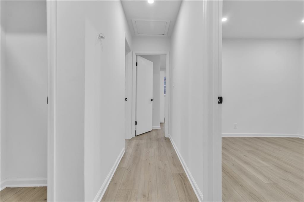 3296 Columbia Woods Drive Decatur, GA 30032 - Photo 27 of 47 a view of a hallway with wooden floor