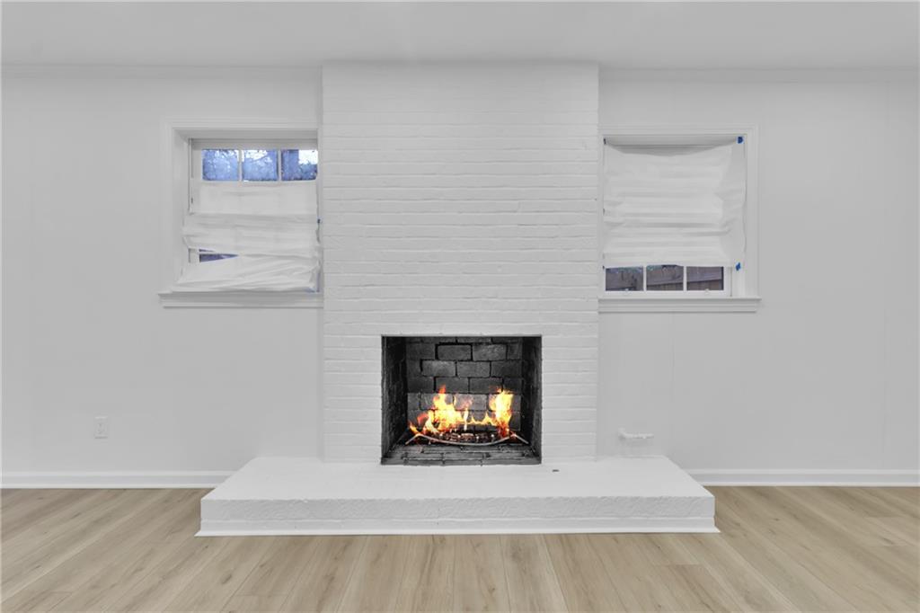 3296 Columbia Woods Drive Decatur, GA 30032 - Photo 33 of 47 a living room with a fireplace and a couch