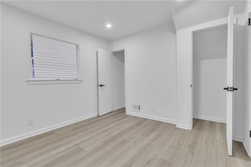 3296 Columbia Woods Drive Decatur, GA 30032 - Photo 35 of 47 an empty room with wooden floor