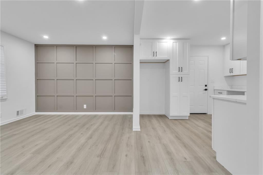 3296 Columbia Woods Drive Decatur, GA 30032 - Photo 36 of 47 a view of a kitchen with wooden floor and a sink