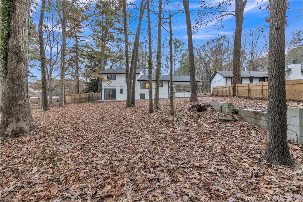 3296 Columbia Woods Drive Decatur, GA 30032 - Photo 38 of 47 a view of a backyard with large trees
