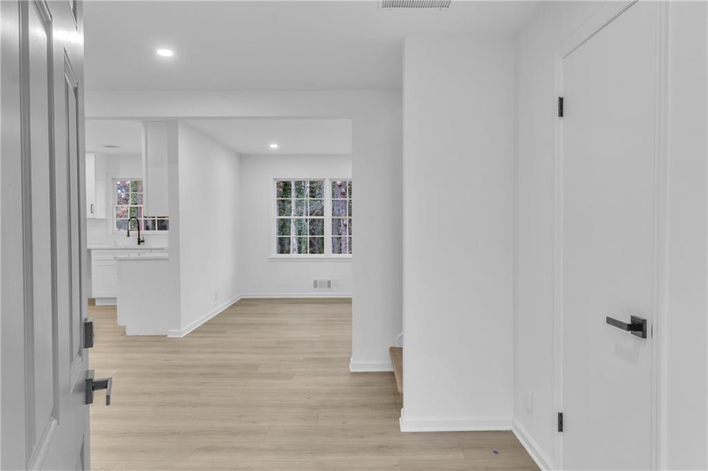 3296 Columbia Woods Drive Decatur, GA 30032 - Photo 7 of 47 wooden floor in an empty room with a window
