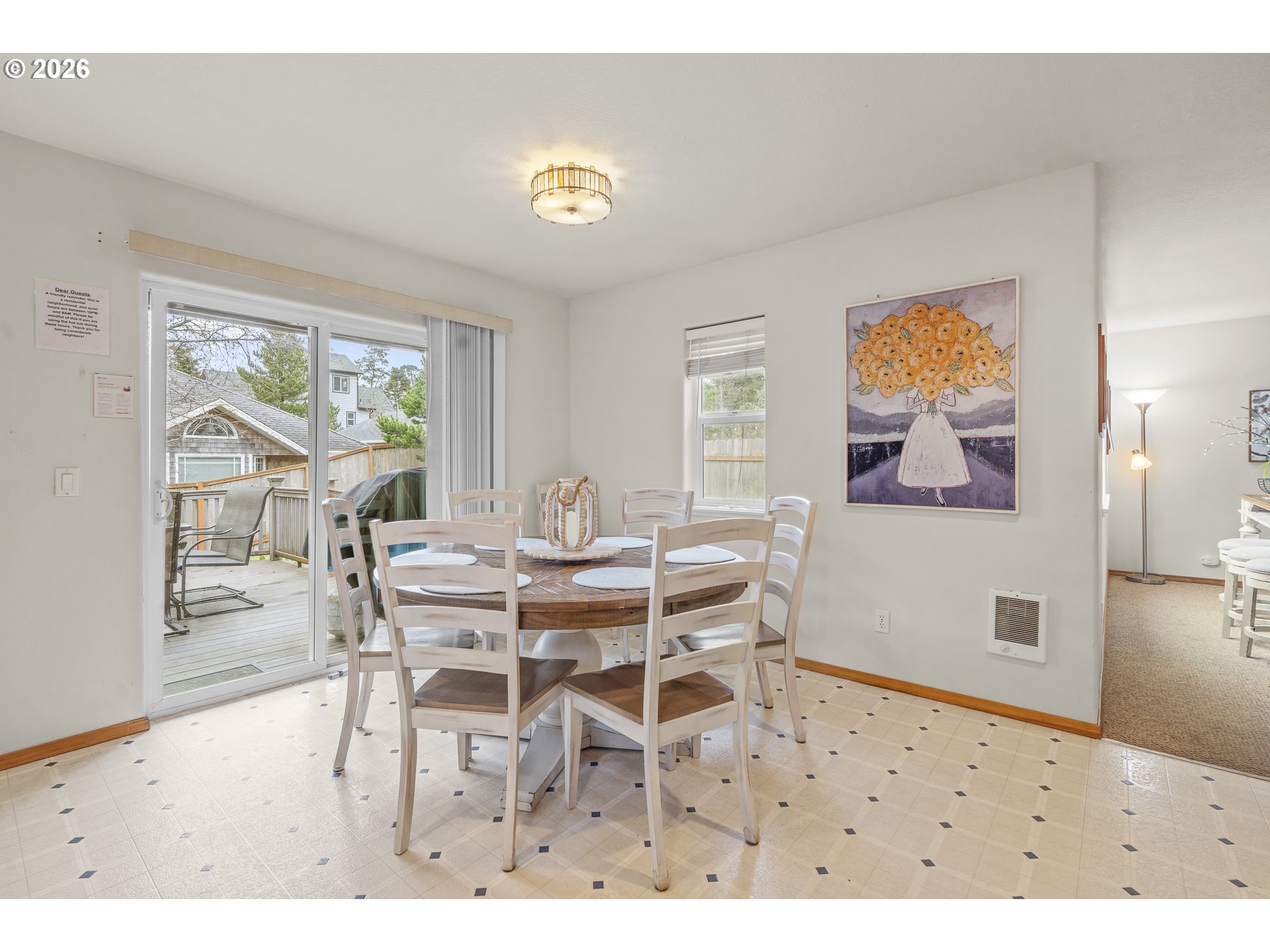 7850 Pine Beach Loop Rockaway Beach, OR 97136 - Photo 12 of 33 a view of a dining room with furniture and a large window