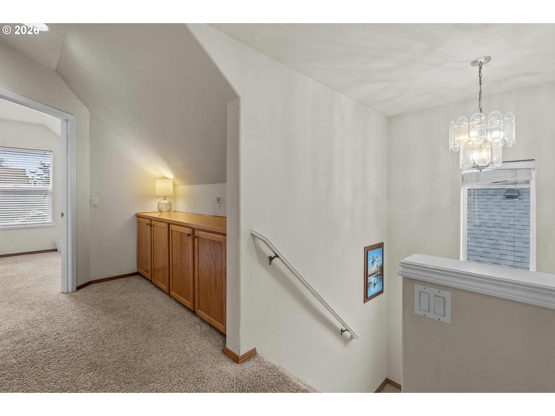7850 Pine Beach Loop Rockaway Beach, OR 97136 - Photo 14 of 33 a view of a kitchen with a sink cabinets and a window