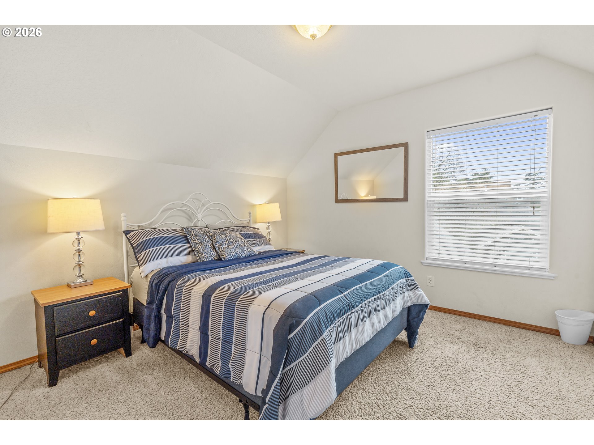 7850 Pine Beach Loop Rockaway Beach, OR 97136 - Photo 19 of 33 a bedroom with a bed and a window