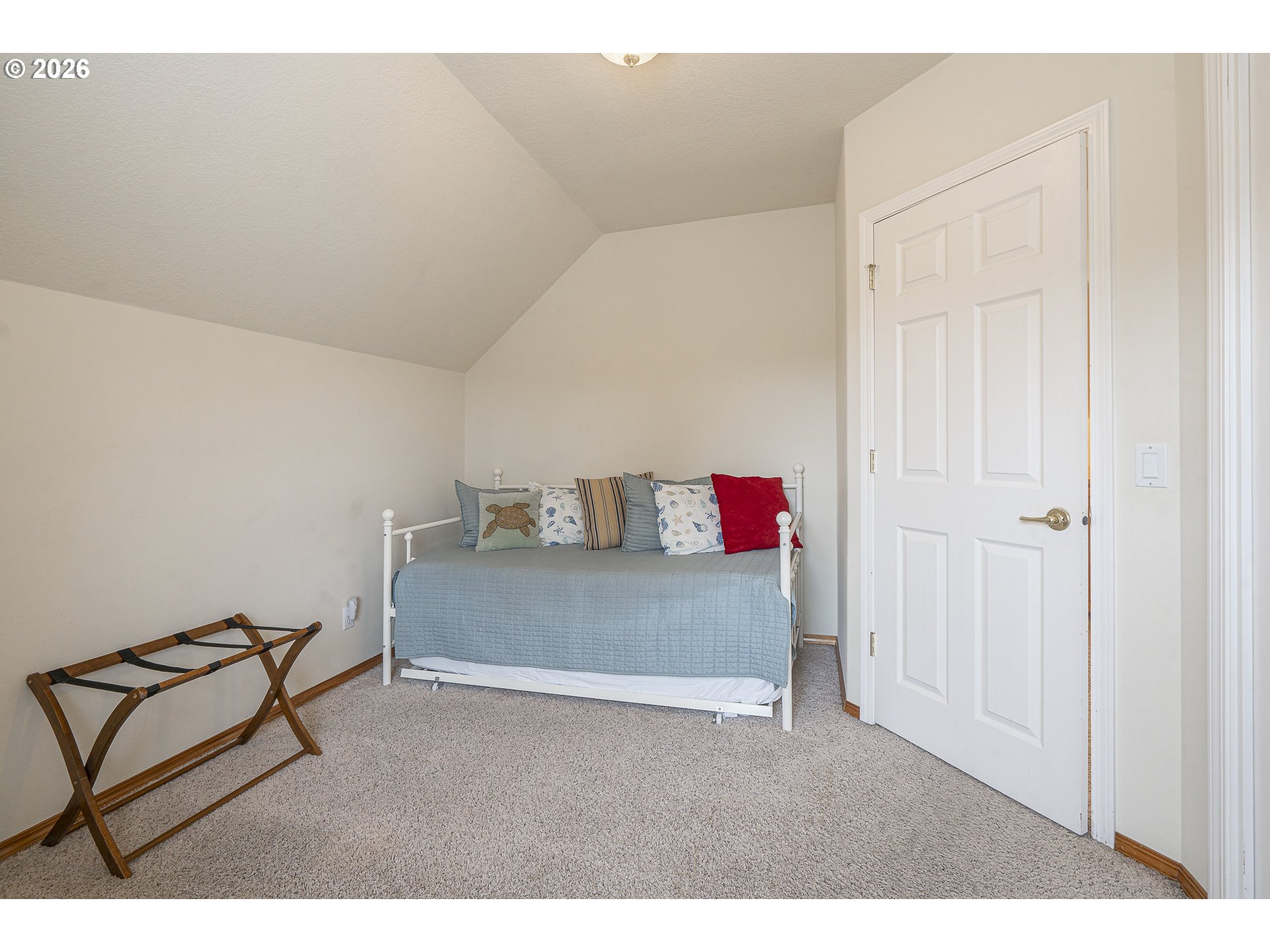 7850 Pine Beach Loop Rockaway Beach, OR 97136 - Photo 20 of 33 a bedroom with a bed and a dresser