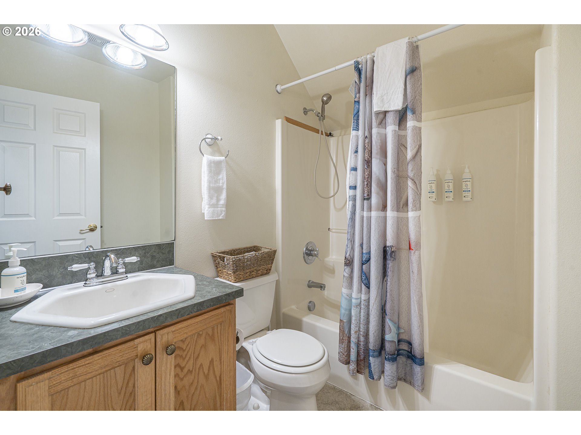 7850 Pine Beach Loop Rockaway Beach, OR 97136 - Photo 21 of 33 a bathroom with a sink toilet and shower