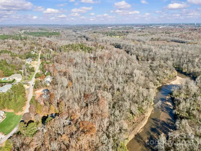 a view of a yard with a building in the background