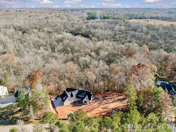 an aerial view of house with yard