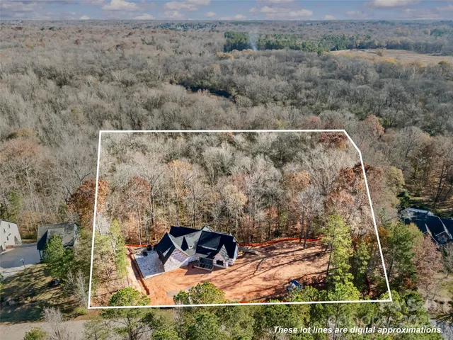 an aerial view of house with yard