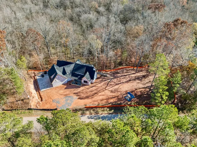 a view of backyard with swimming pool