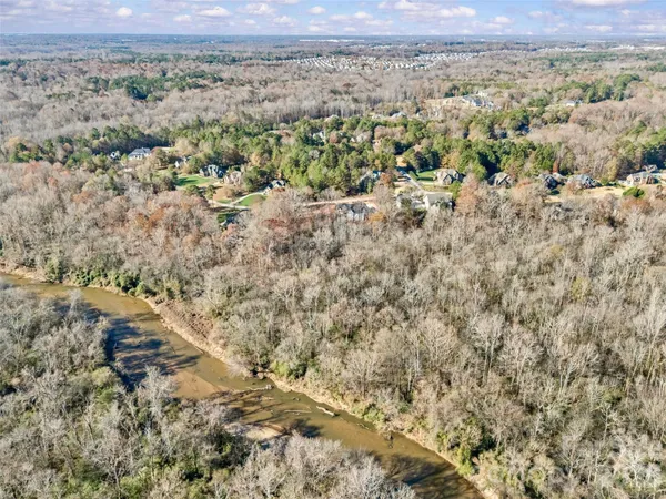 a view of a yard with a building in the background