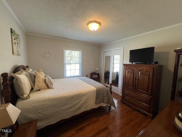 663 Fleming Road Coats, NC 27521 - Photo 11 of 42 a bedroom with bed and tv