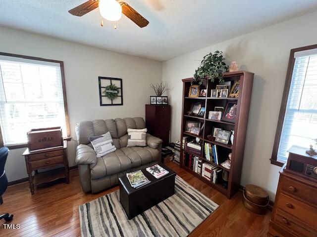 663 Fleming Road Coats, NC 27521 - Photo 14 of 42 a living room with furniture a bookshelf and a window