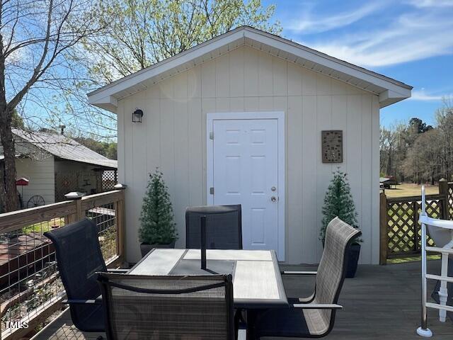 663 Fleming Road Coats, NC 27521 - Photo 16 of 42 a backyard of a house with table and chairs