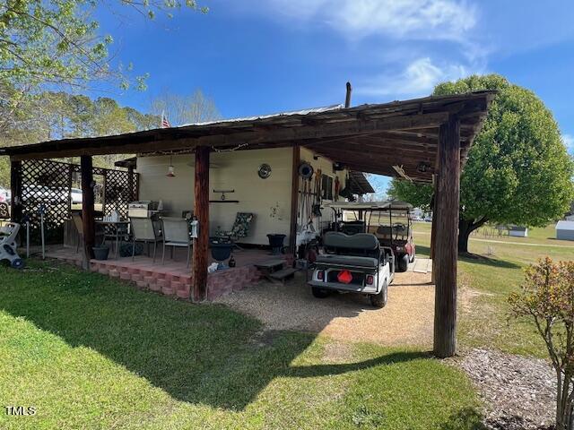 663 Fleming Road Coats, NC 27521 - Photo 21 of 42 a car parked in front of a house