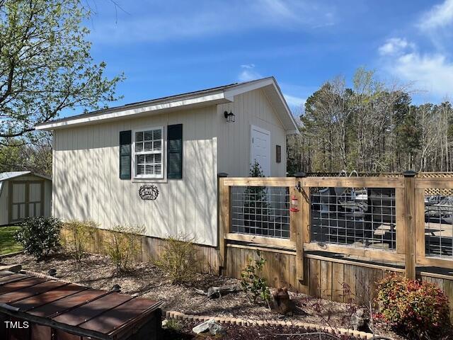 663 Fleming Road Coats, NC 27521 - Photo 24 of 42 a view of a house with a yard