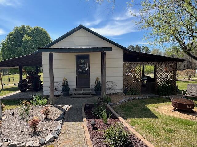 663 Fleming Road Coats, NC 27521 - Photo 25 of 42 a front view of a house with garden